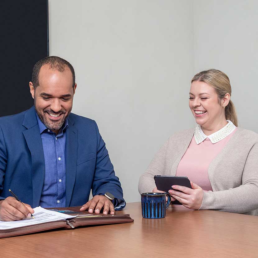 A financial professional meets with his client to discuss adding TruStage annuities to her retirement portfolio