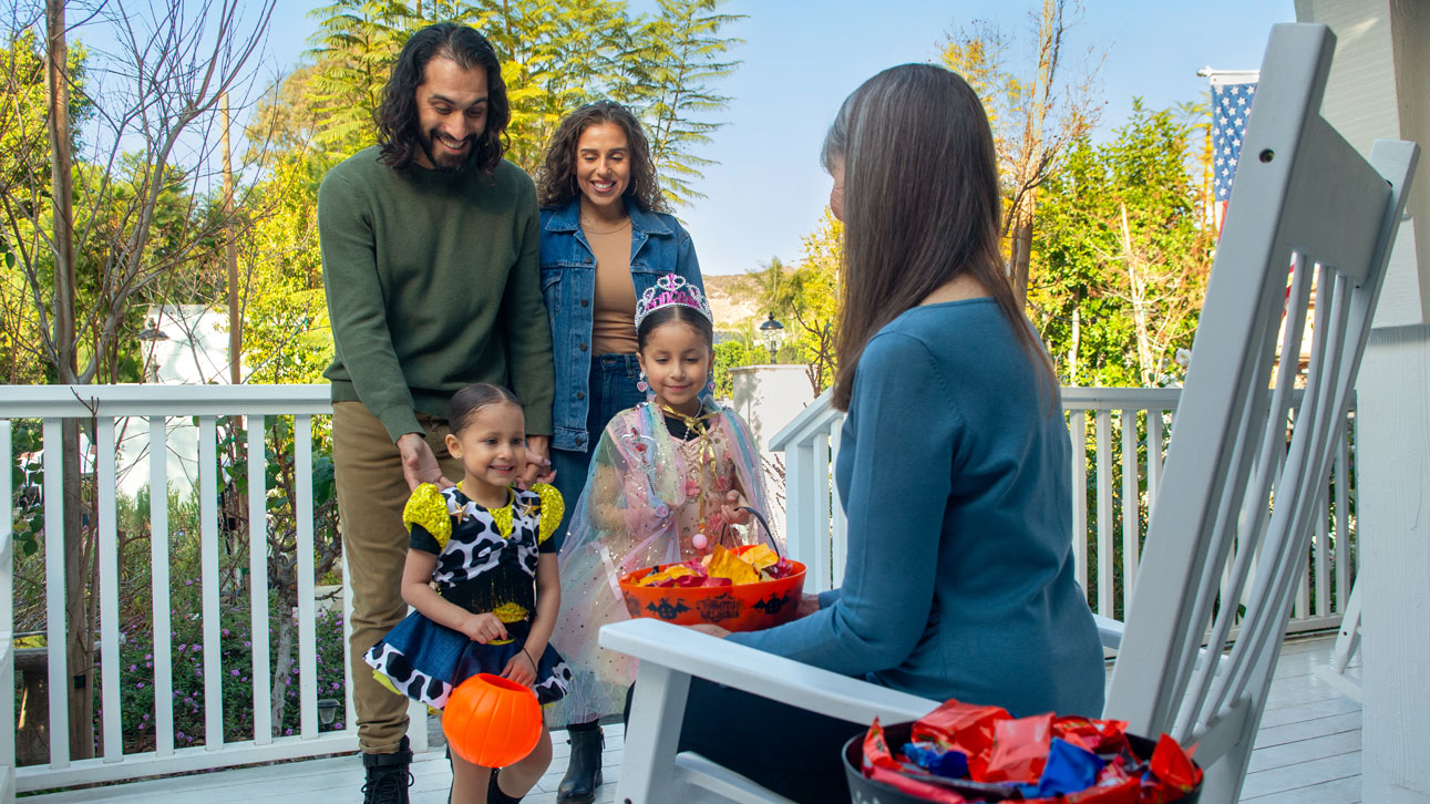 A family smiles with peace because of TruStage debt protection
