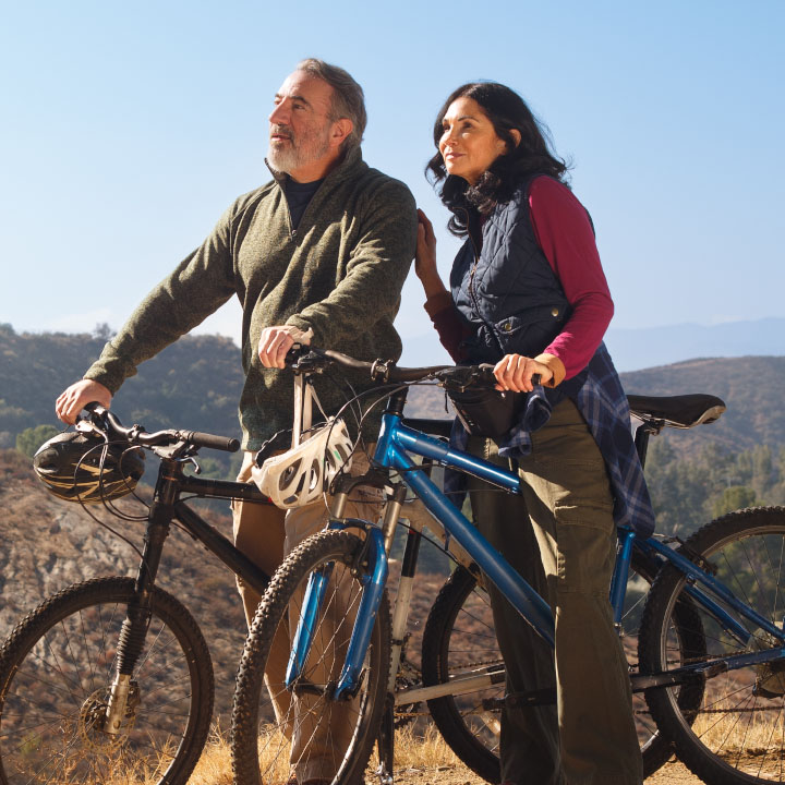 A couple taking a break from riding their bikes
