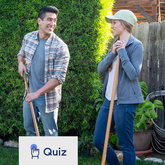 A man and woman doing yardwork