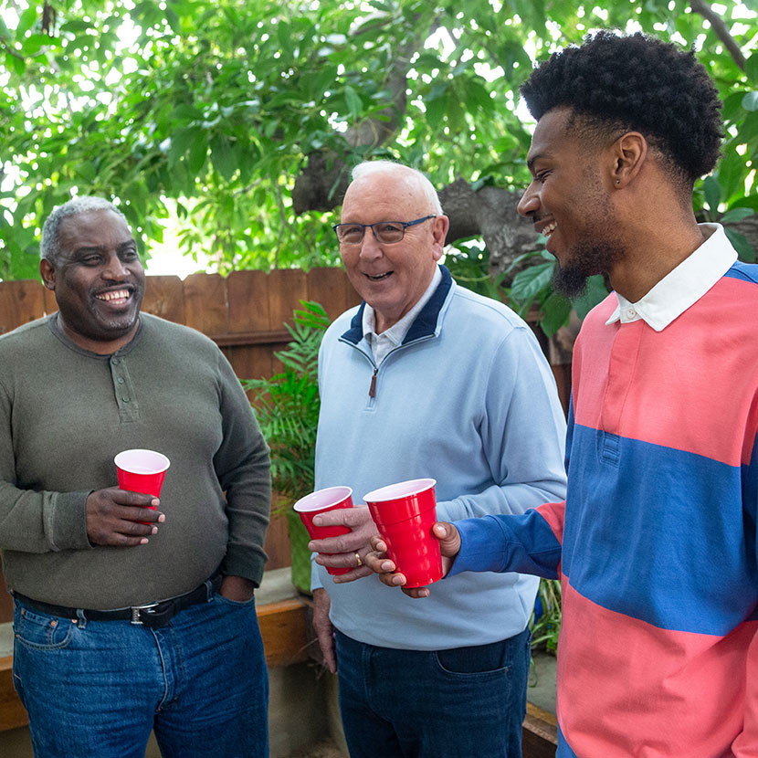 A group of men talk about their TruStage™ retirement portfolios. 